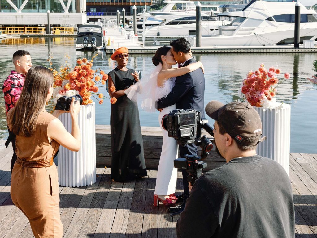 DC wedding officiant Starlene Joyner Burns with a couple during an outdoor ceremony, highlighting value and professional officiant services