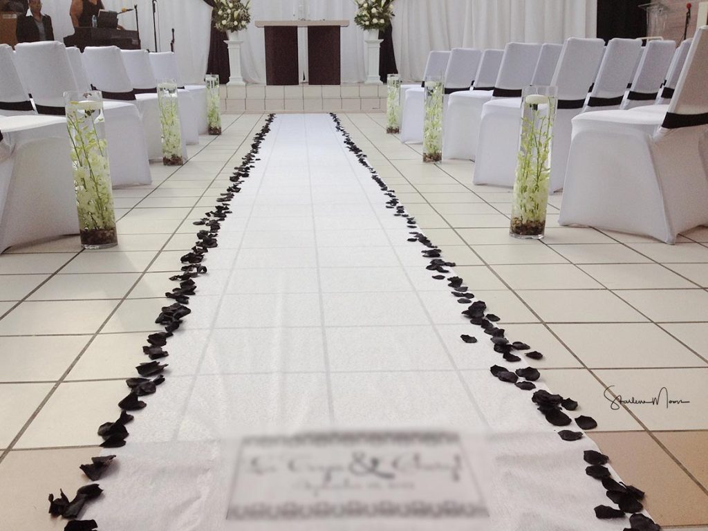 Safety tips for using a wedding aisle runner with floating candles, shared by The DC Marriage Knot to ensure a secure and elegant ceremony in DC, MD, and VA