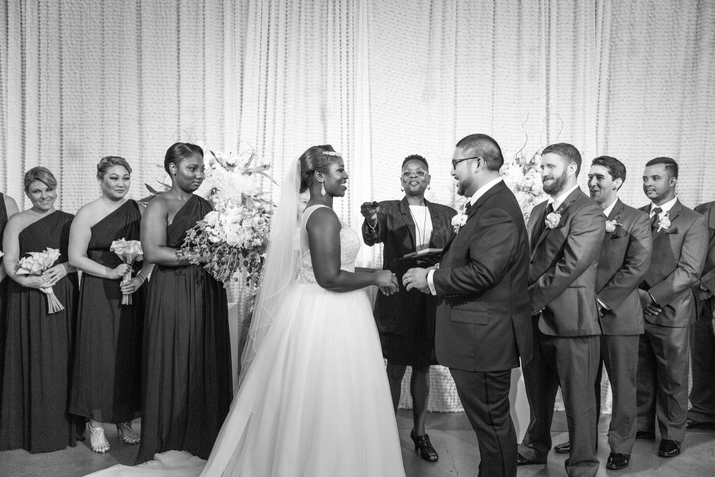 Bride and groom with their wedding party during the ceremony, officiated by DC officiant Starlene